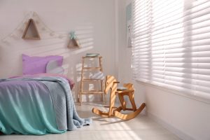 Blinds and bed in children`s room